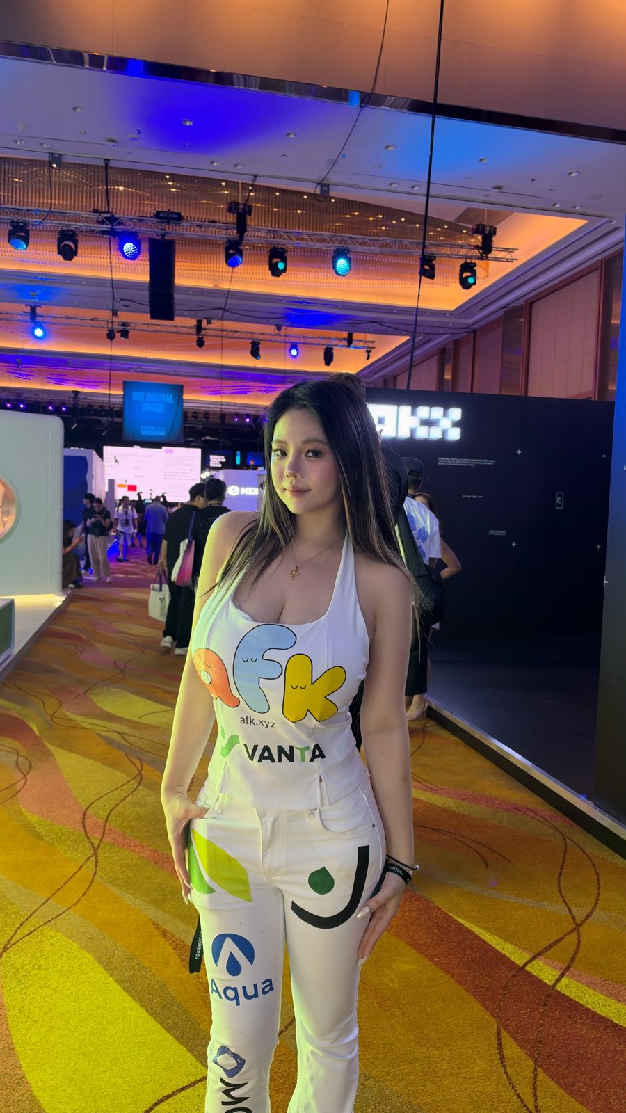 Riri in the dress on the TOKEN2049 floor, front
